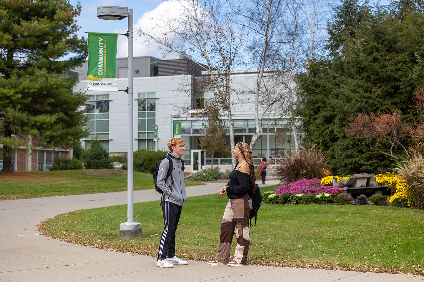 two students talking on SUNY Adirondack campus in Queensbury, NY